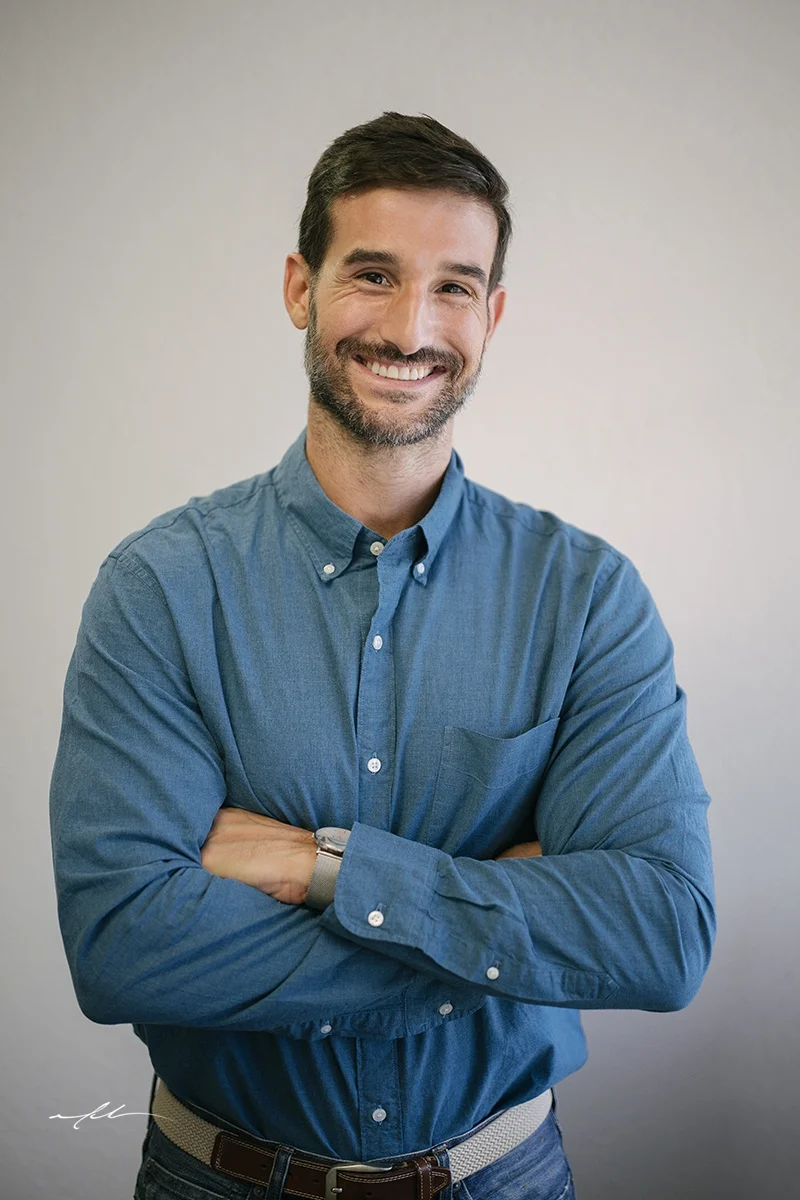 Dr. Nick Deliberato smiling with arms crossed